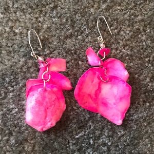 Pink statement earrings.